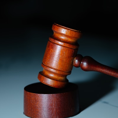 a wooden judge's hammer on top of a table