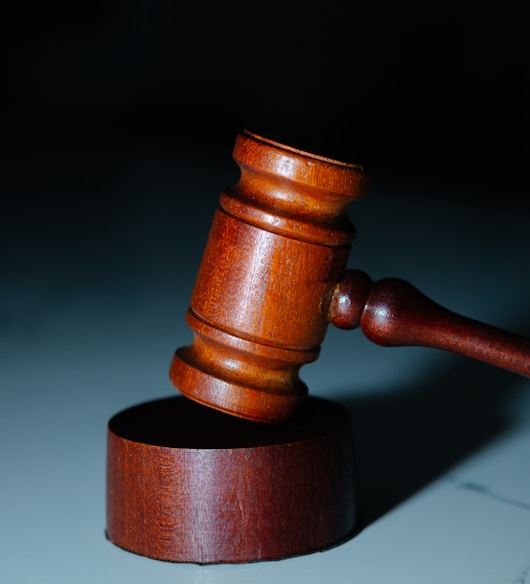 a wooden judge's hammer on top of a table