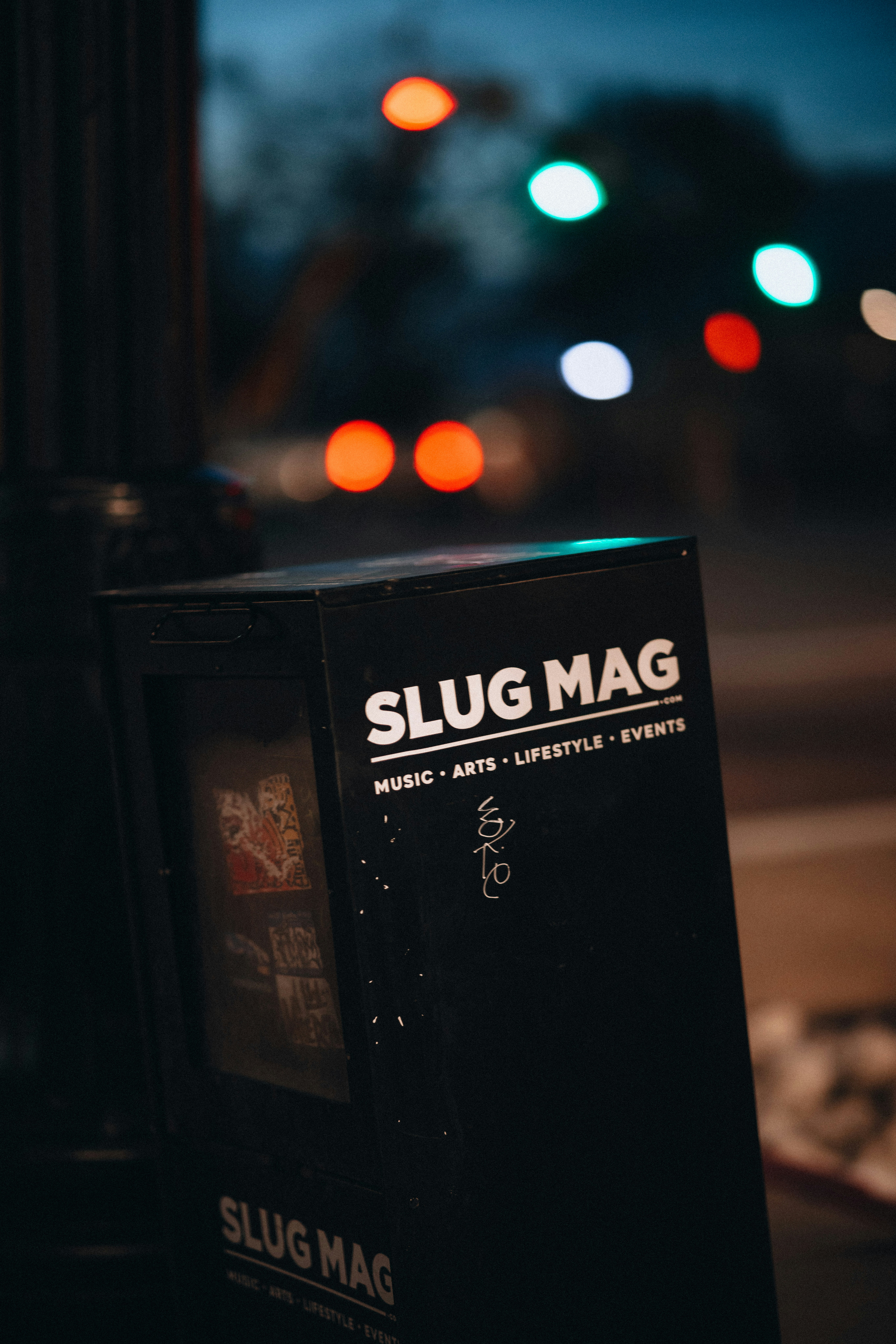 a street sign sitting on the side of a road