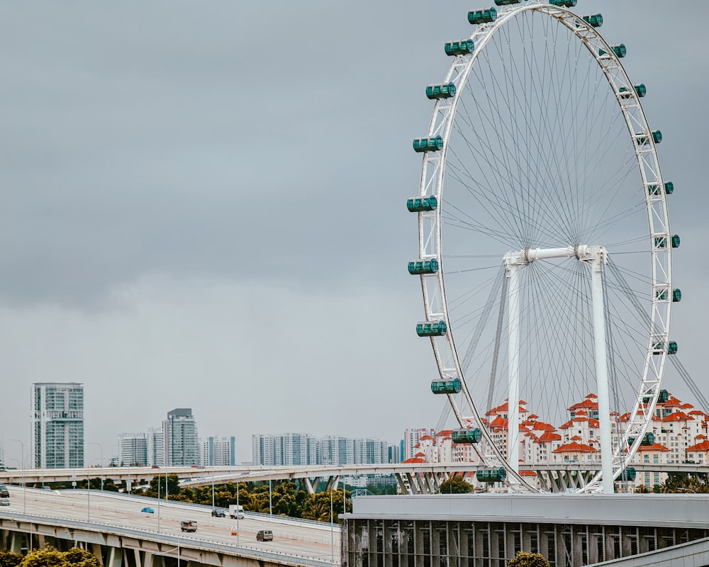 a large ferris wheel on a cloudy day