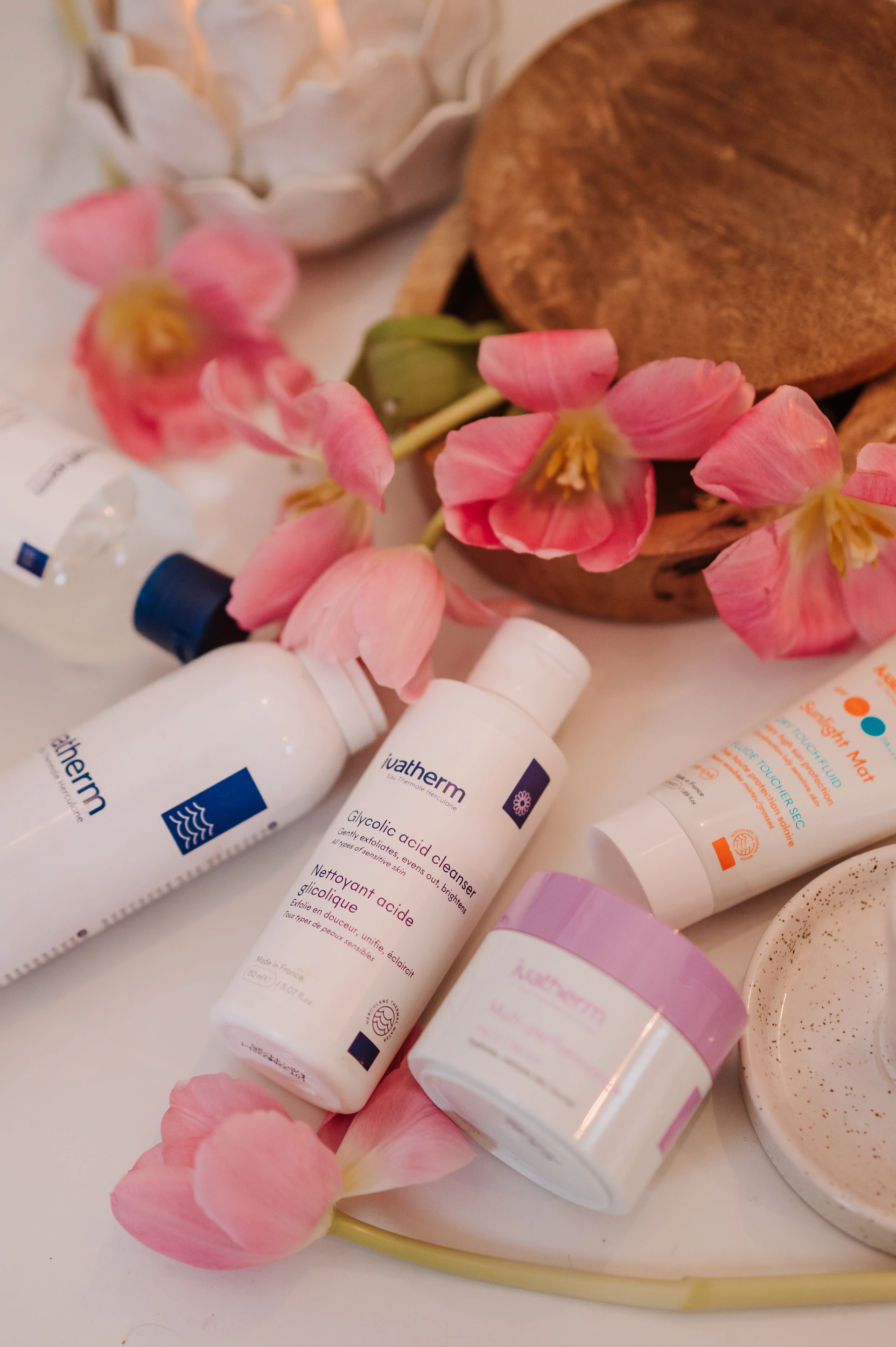 a table topped with lots of different types of skin care products