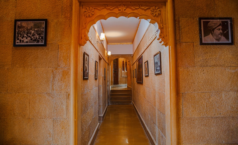 a long hallway with pictures on the walls