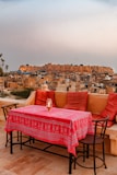 a table with a red tablecloth on top of it
