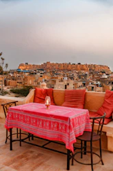 a table with a red tablecloth on top of it
