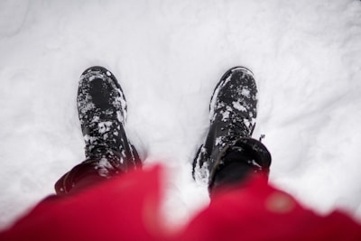 A cozy winter scene featuring stylish black heeled boots.