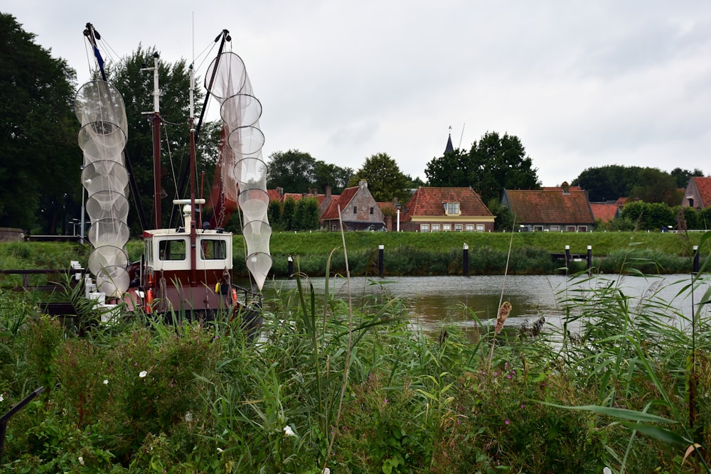 a red and white boat in a body of water