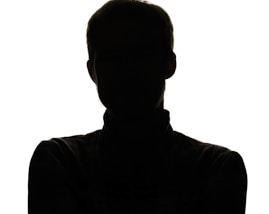 a silhouette of a man with his arms crossed