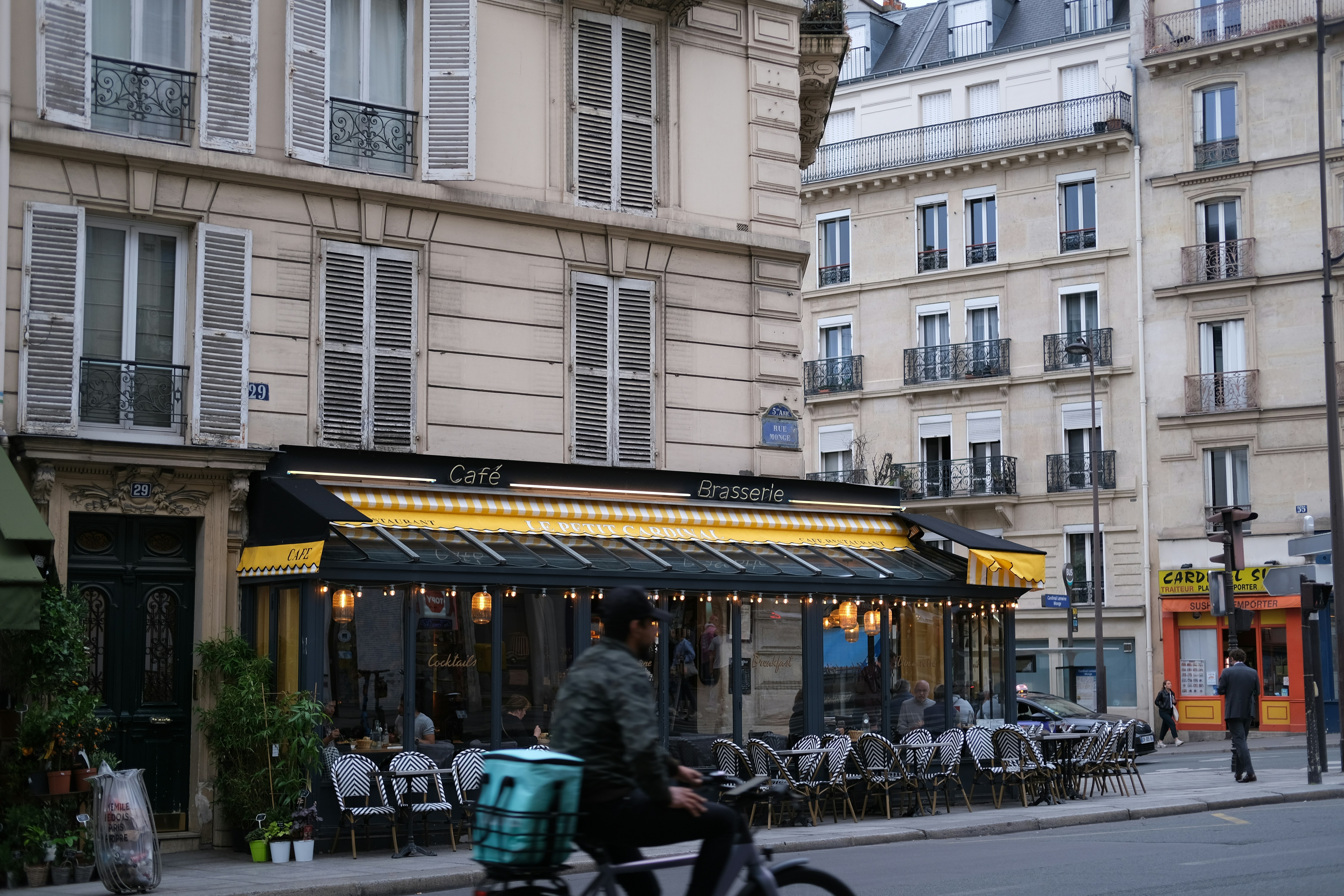 a person riding a bike down a street