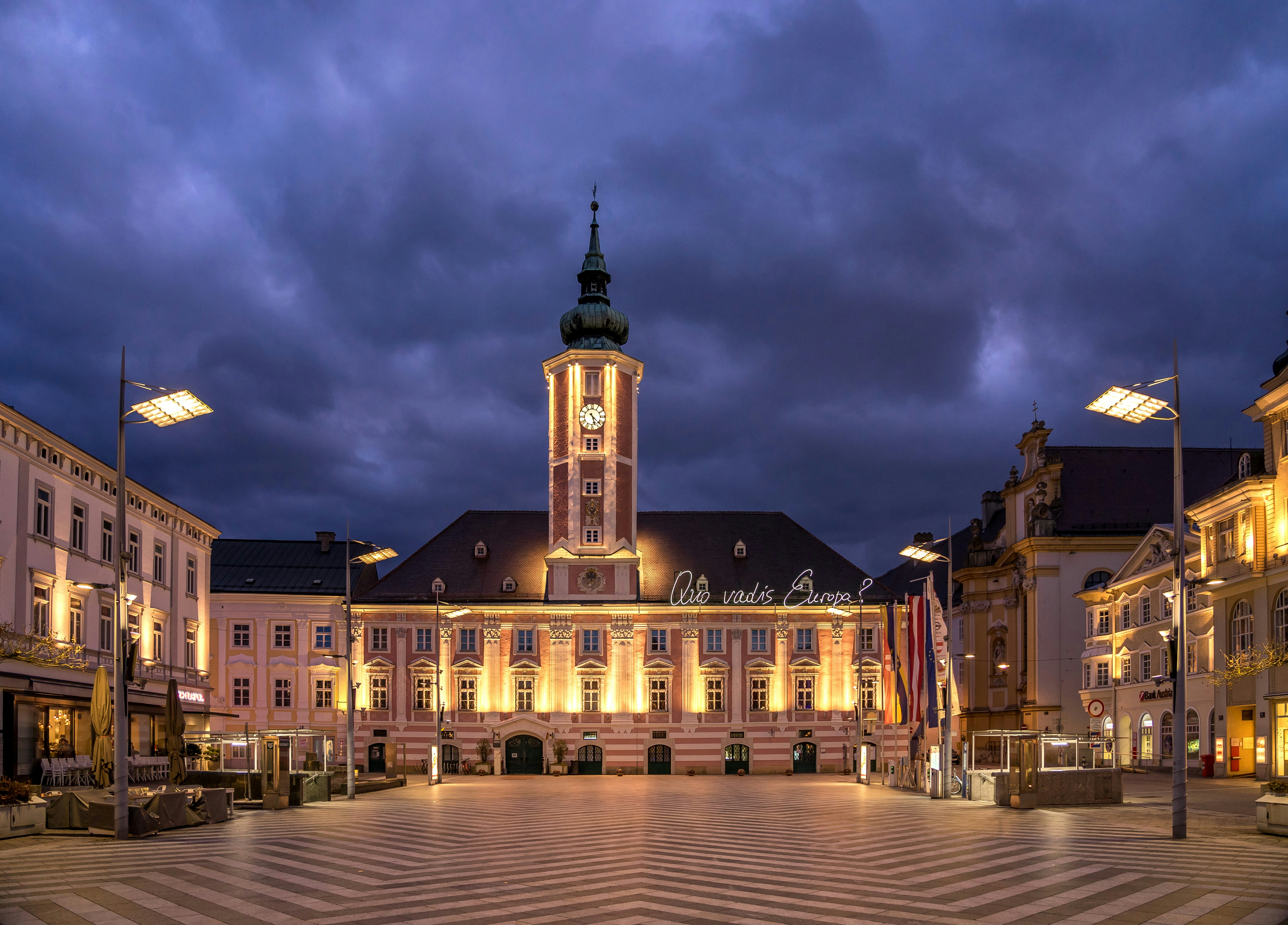 a building with a clock tower lit up at night