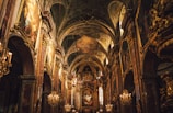 the interior of a church with gold decorations