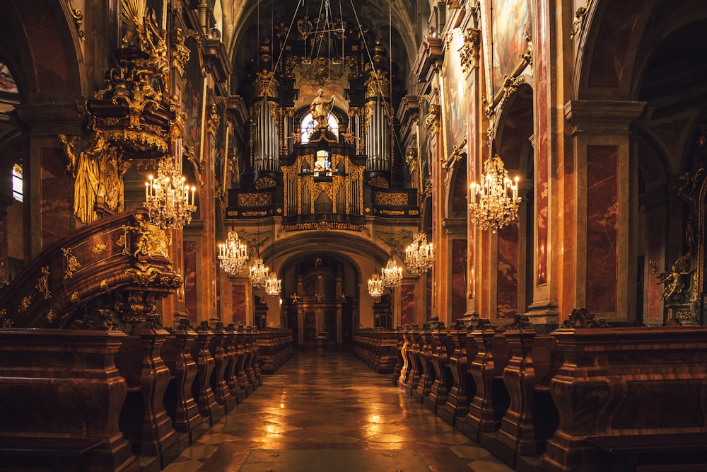 a large cathedral with chandeliers and a clock