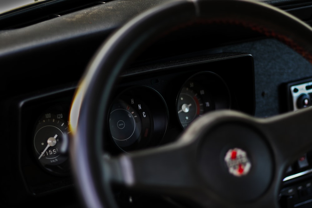 a close up of a steering wheel and dashboard of a car