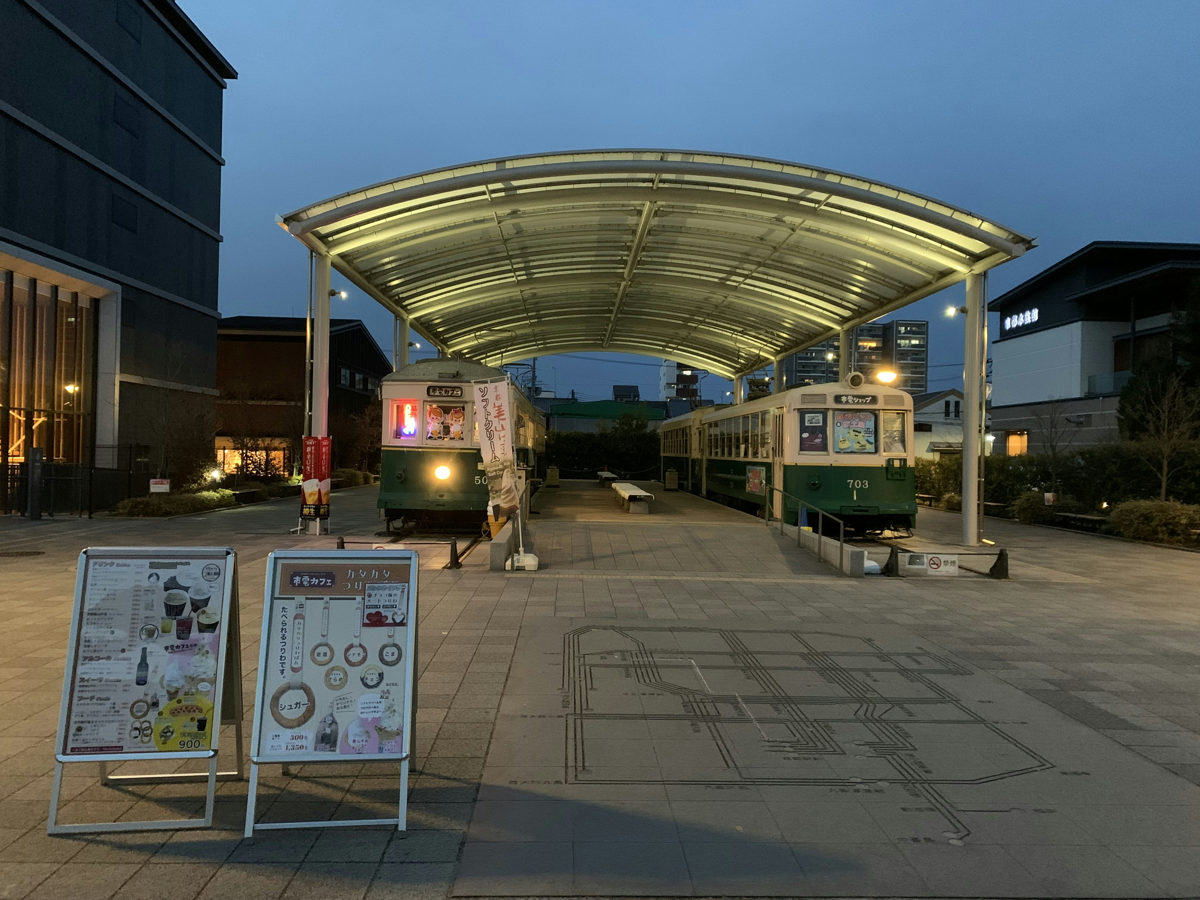 a train station with a train on the tracks