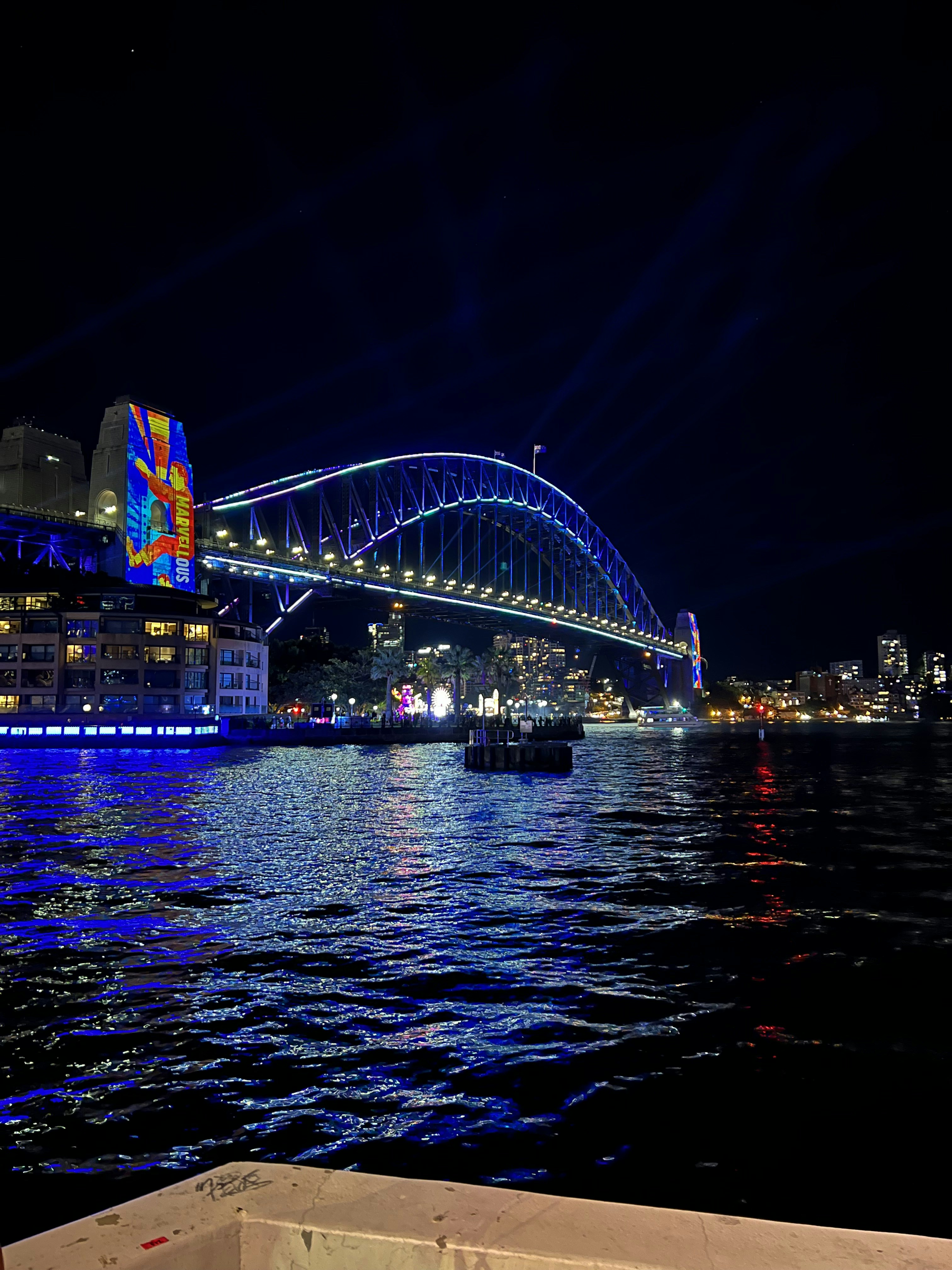 A large bridge over a body of water at night photo – Free Cityscape ...