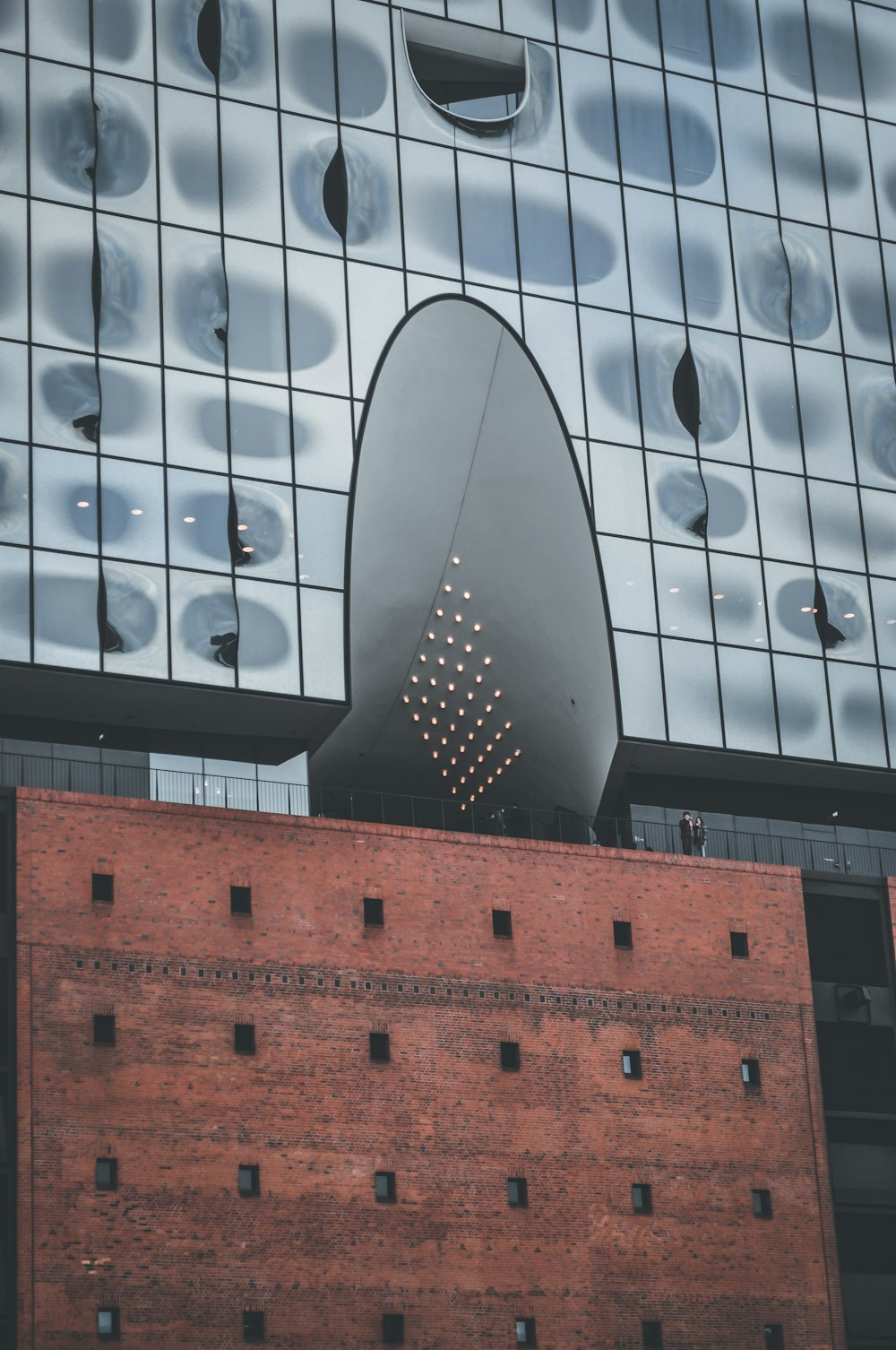 a tall building with a large metal object on top of it