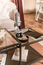 a microphone sitting on top of a glass table