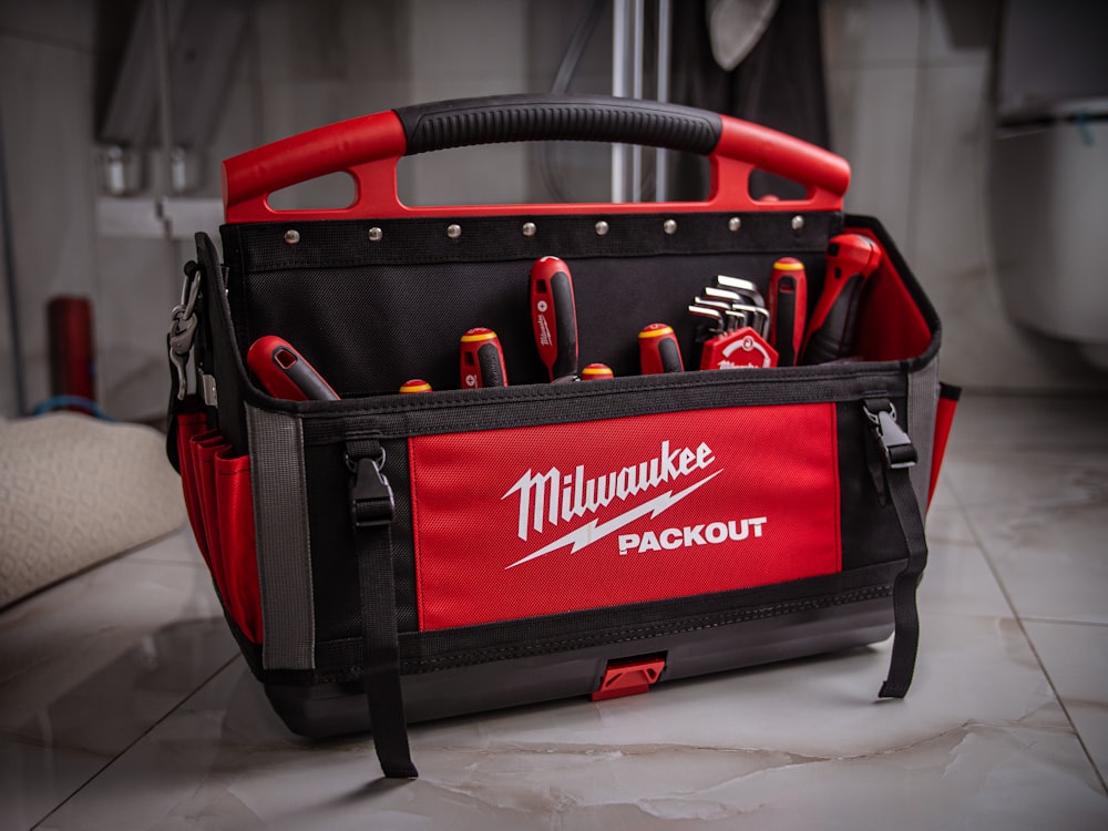 a tool bag with tools inside of it