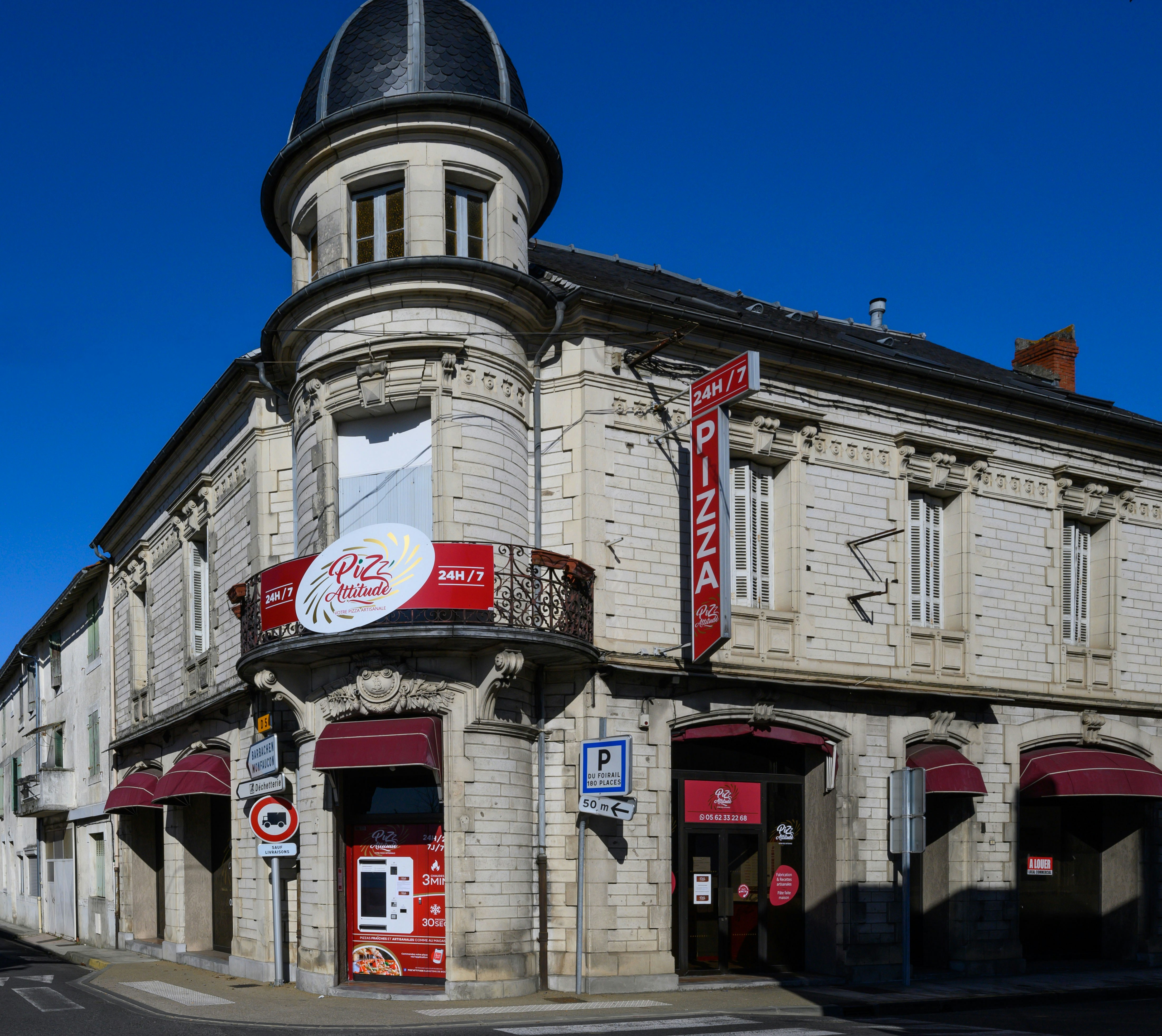 a building with a red and white sign on the front of it