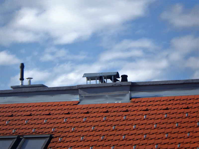 rooftop ventilation units along a building roofline