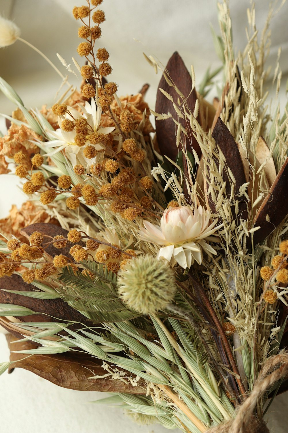 a bunch of dried flowers sitting on top of a table