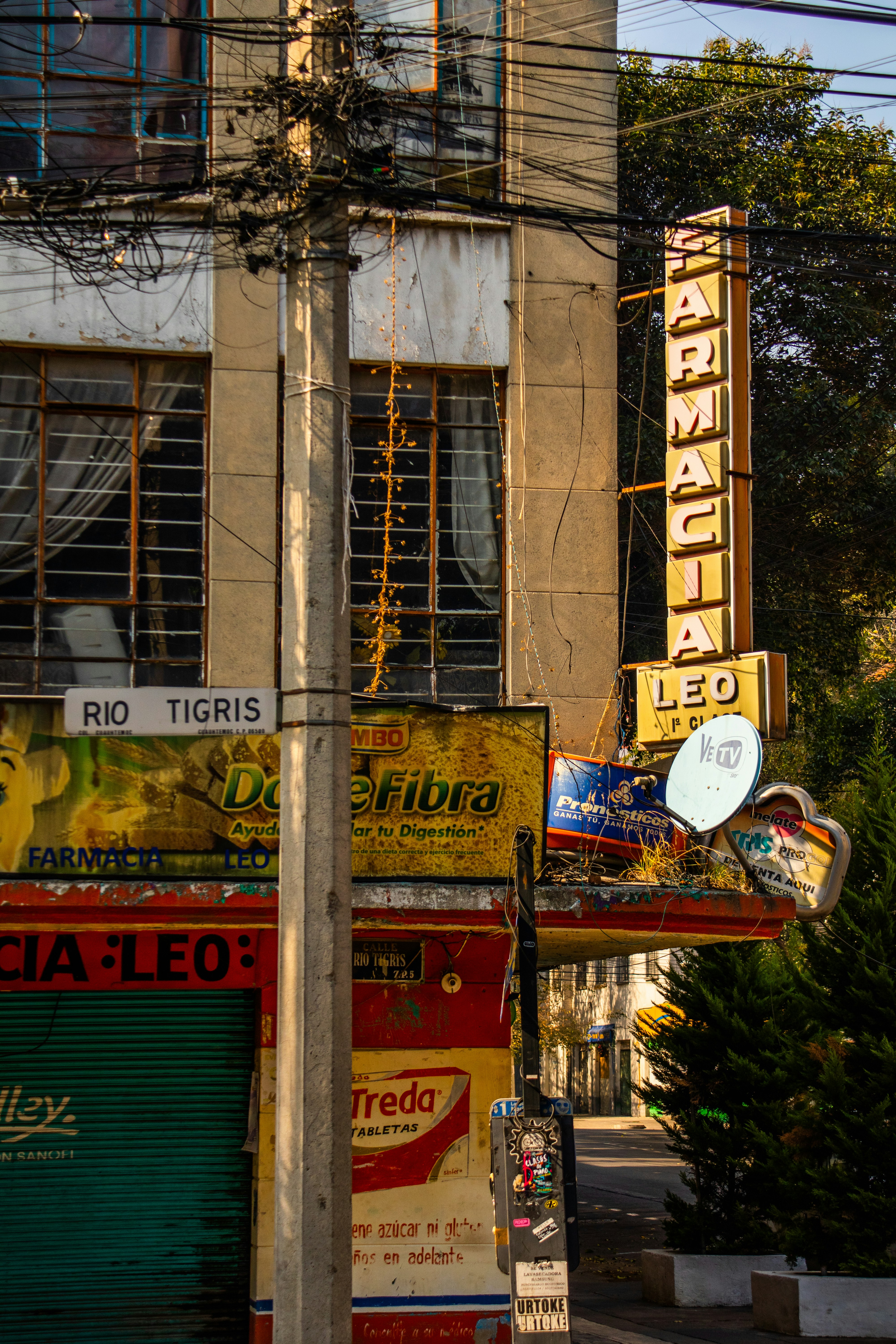 a building with a neon sign on the side of it