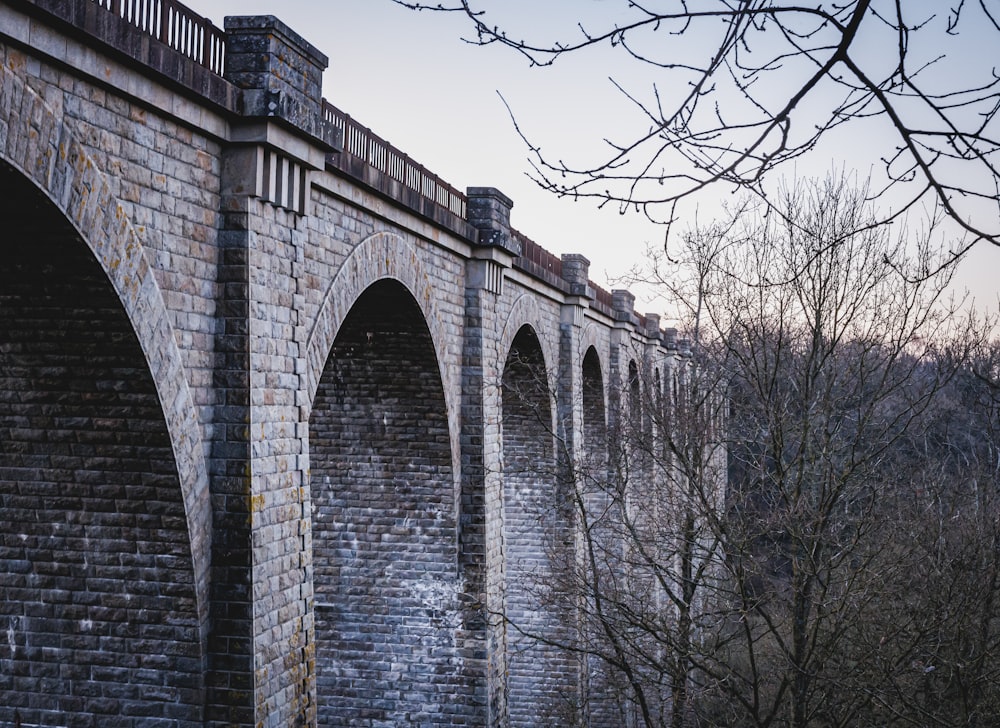 a stone bridge with arches and arches on it