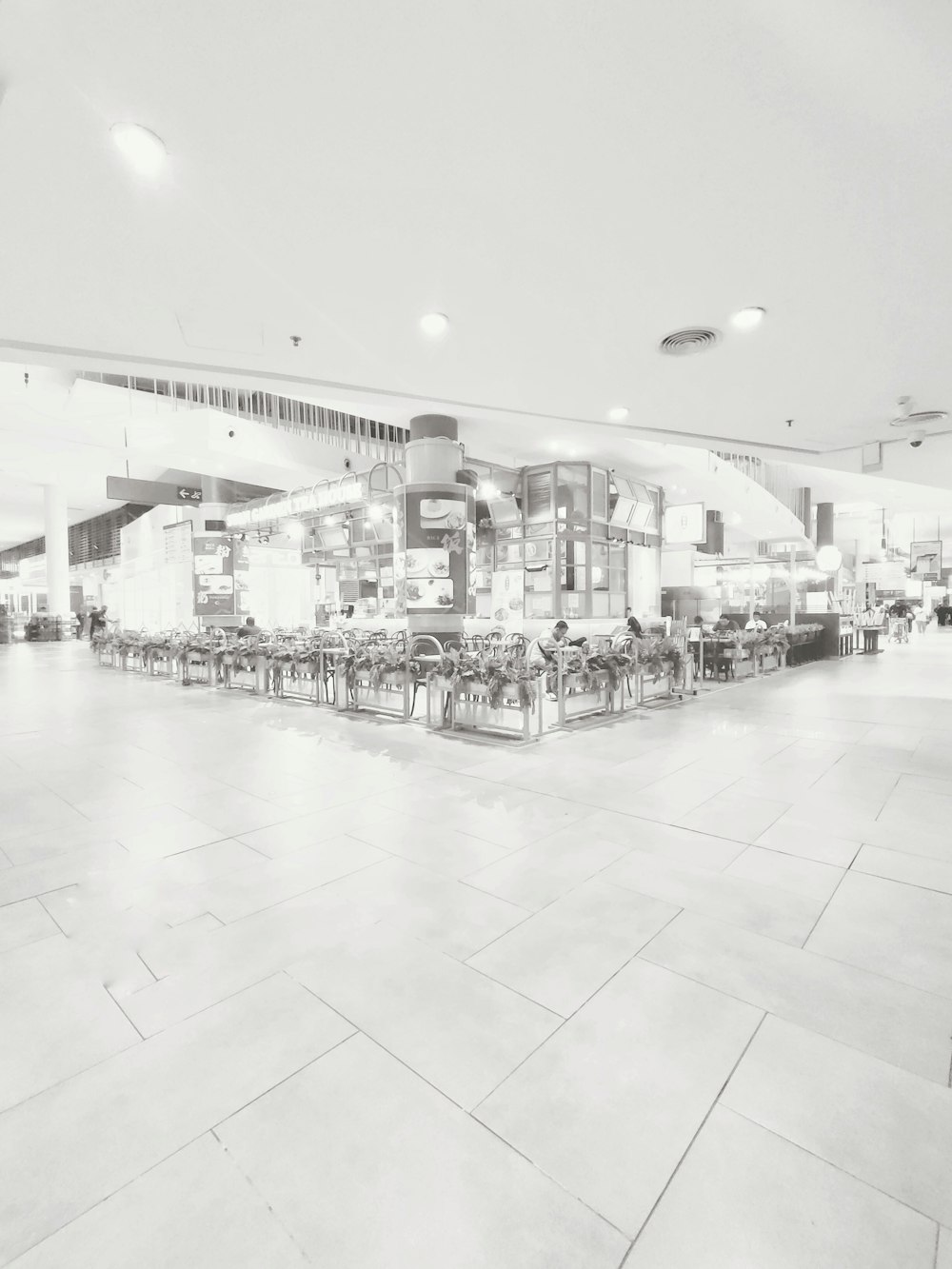a black and white photo of a restaurant