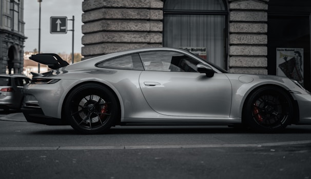 Renault Megane parked on a city street, silver color.