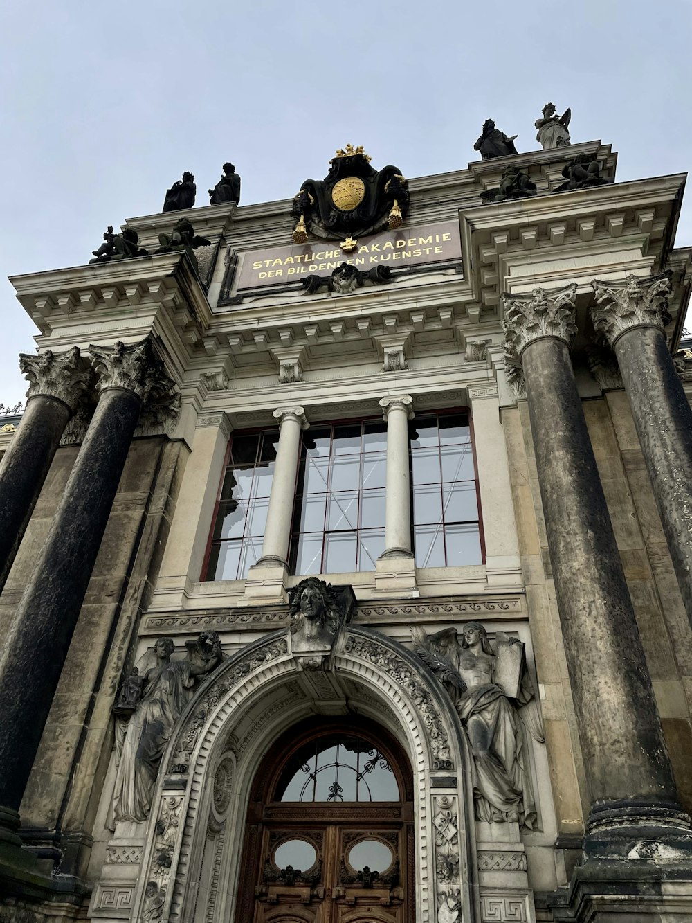 a large building with columns and a door