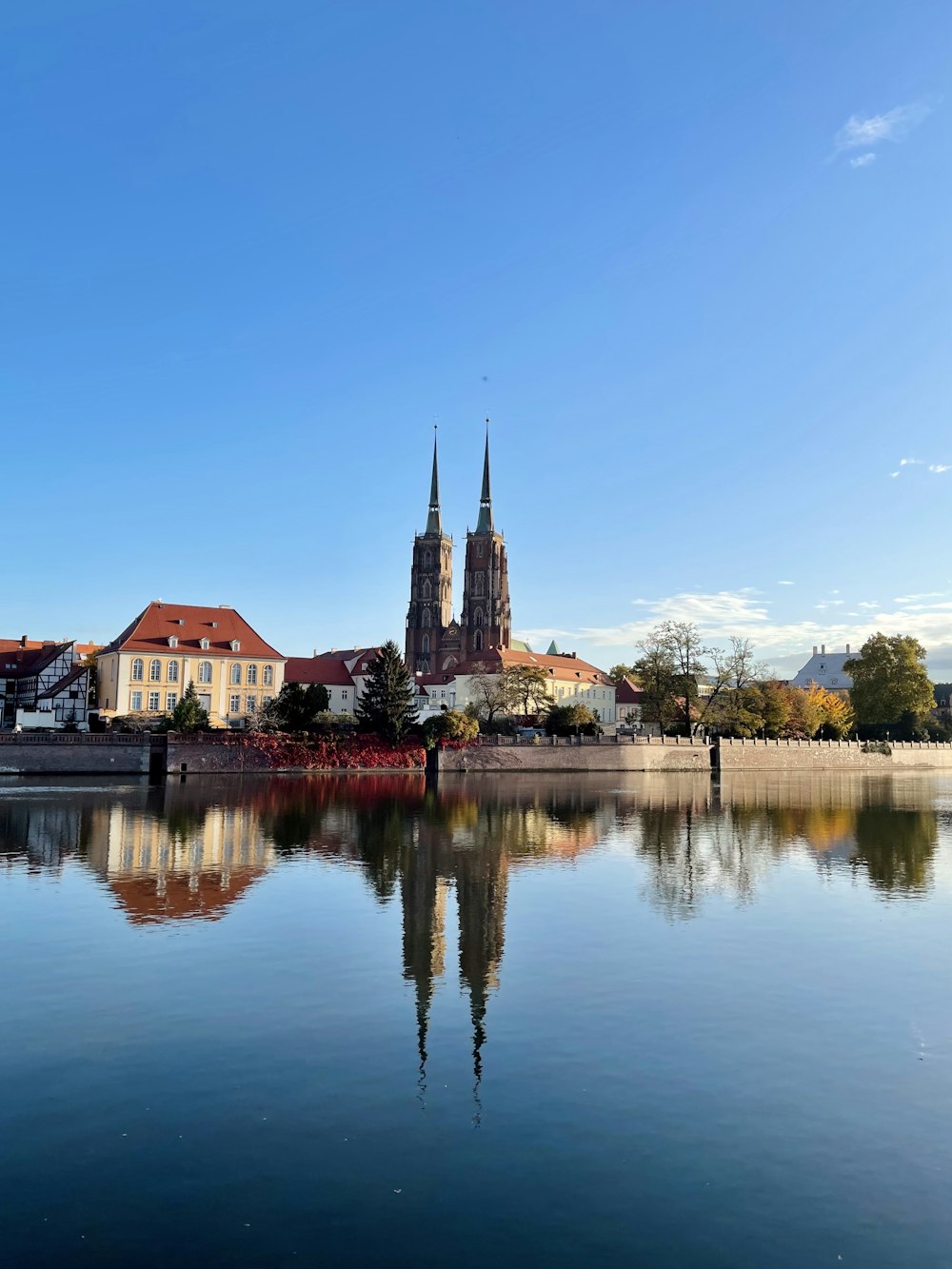 a large body of water with buildings in the background