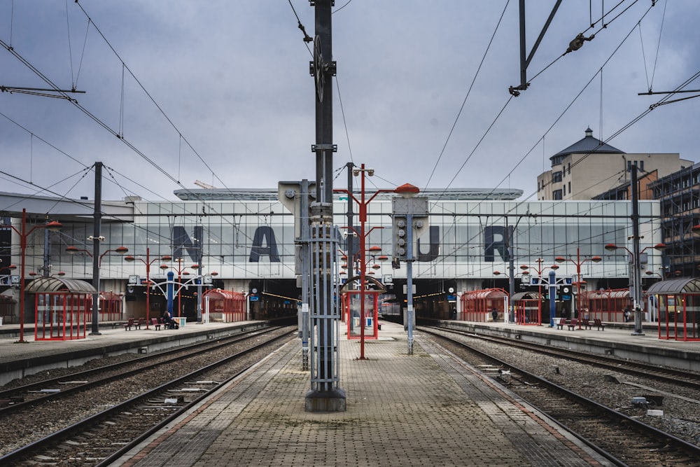 a train station with a train on the tracks