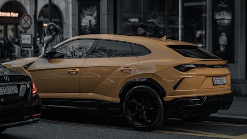Golden SUV parked on a city street, reflecting the urban lifestyle.