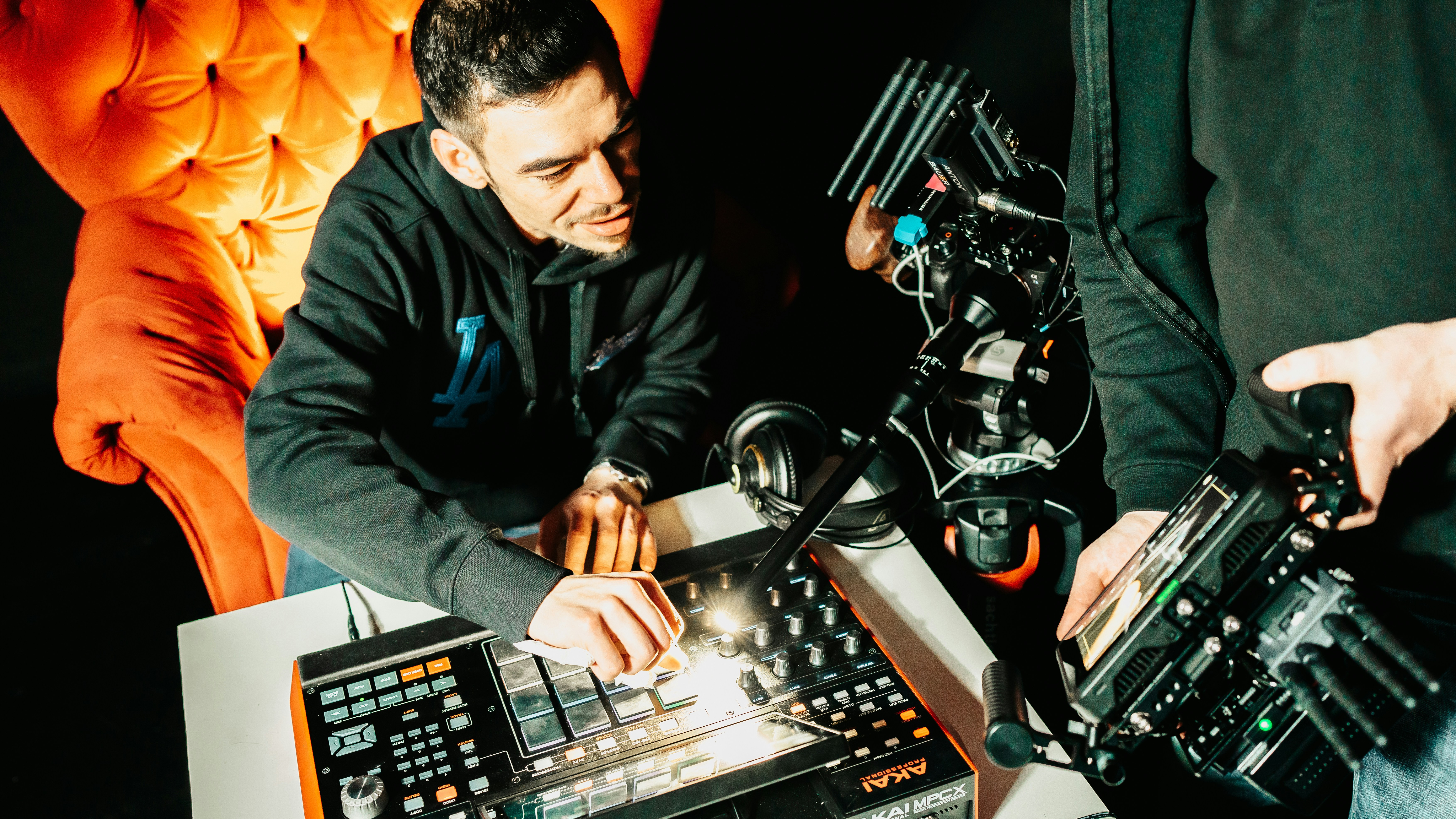 a couple of men sitting next to each other