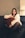 a woman sitting on top of a black couch