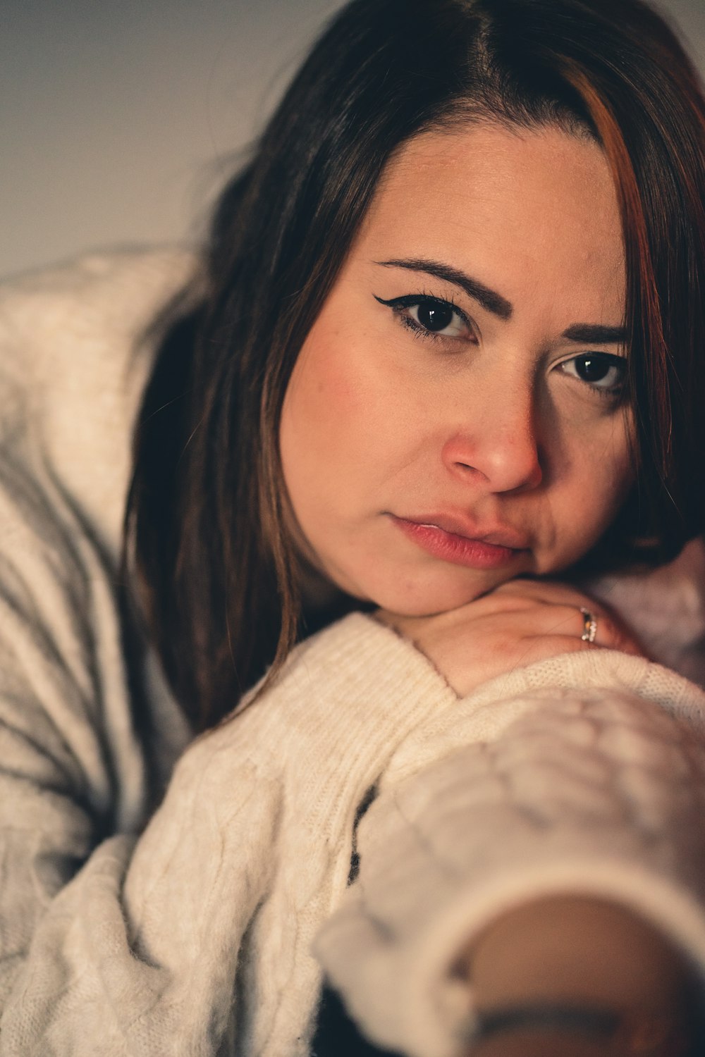 a close up of a person wearing a sweater