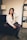 a woman sitting on a couch in a room
