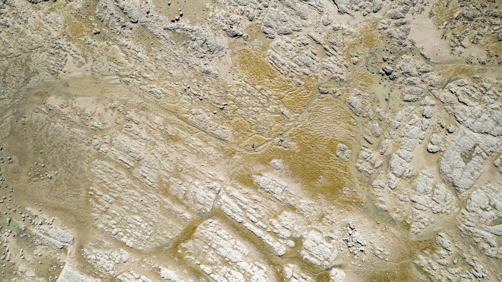 an aerial view of a desert area with rocks and dirt