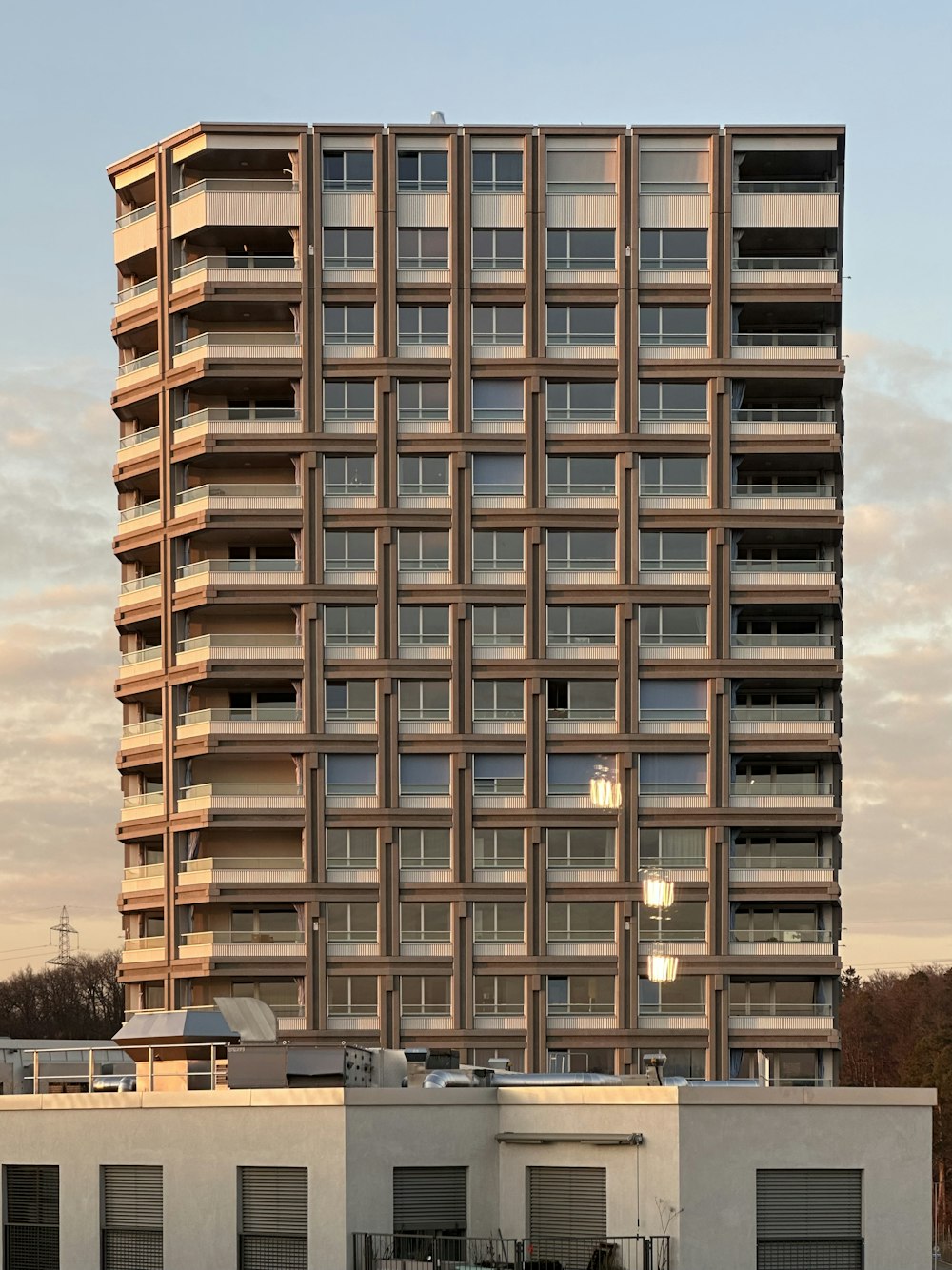 a tall building with lots of windows and balconies