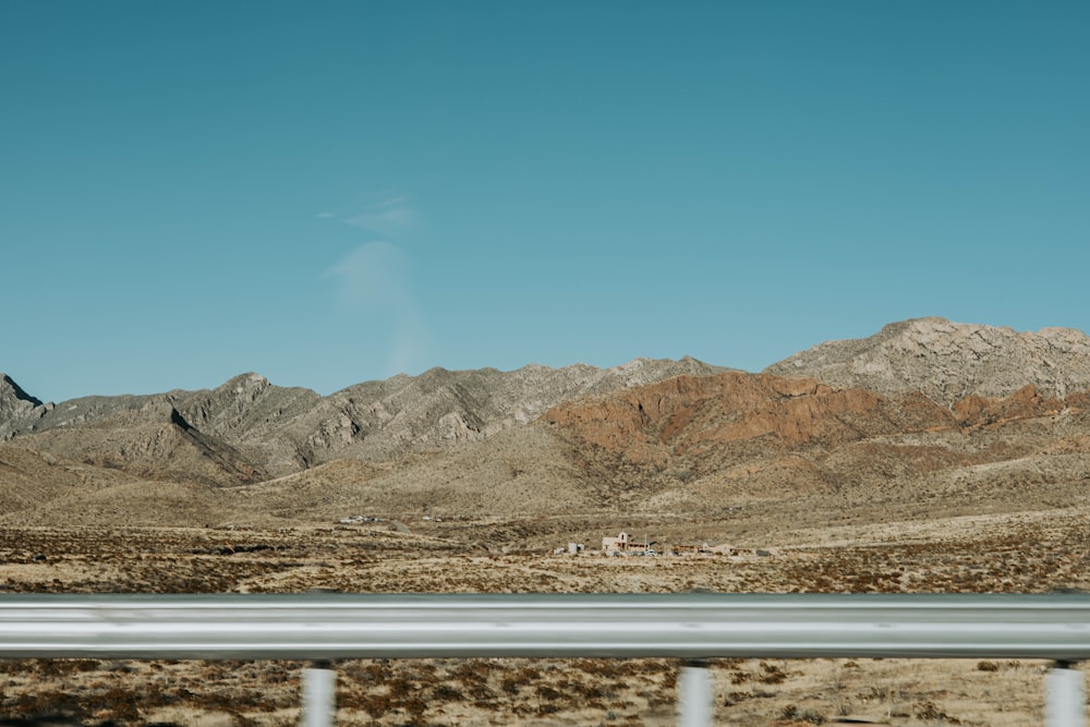 a view of a mountain range from a highway