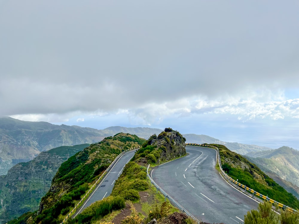 a winding road on the side of a mountain