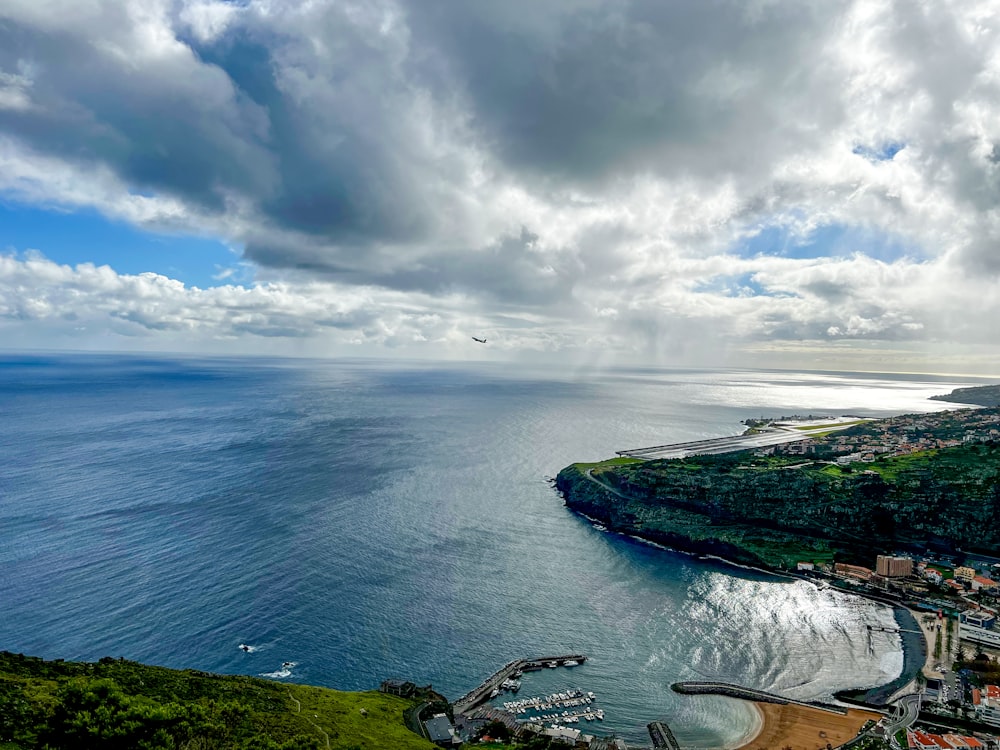 an aerial view of a city and the ocean