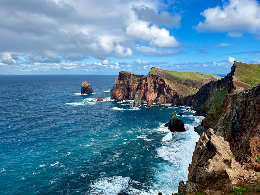 a view of the ocean from the top of a cliff