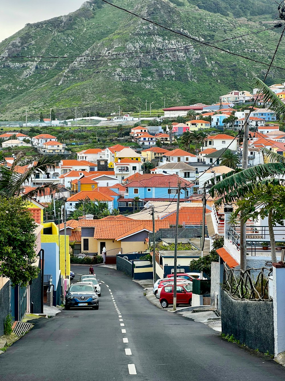 a city street with a mountain in the background