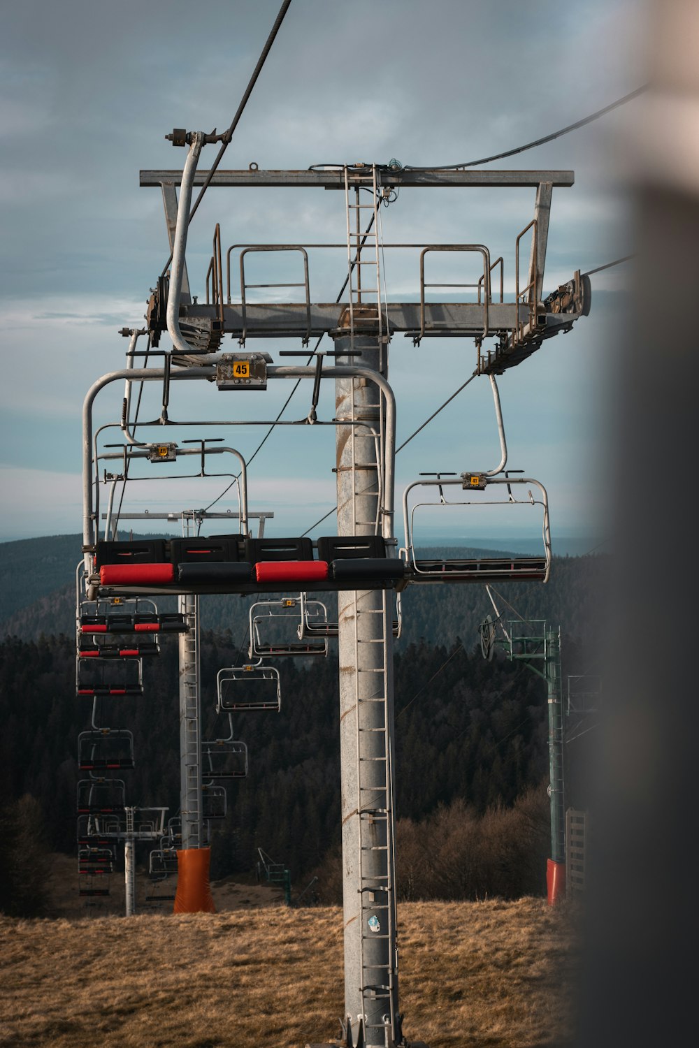 a view of a ski lift with a mountain in the background