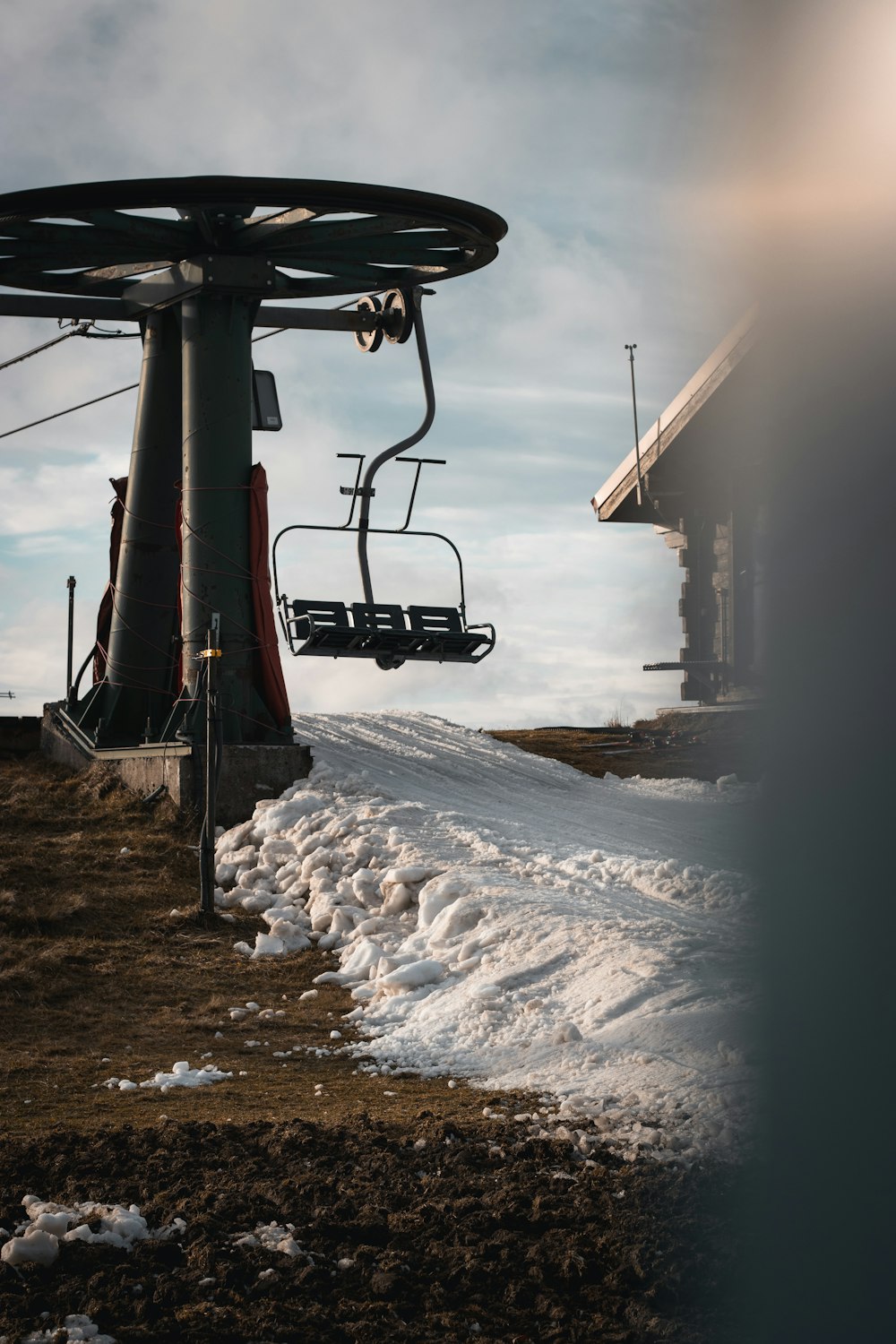 a ski lift going up a snowy hill