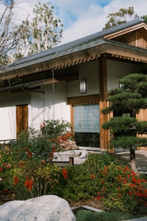 a house with a stone bench in front of it