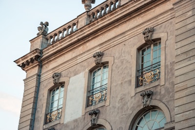 Elegant townhouse facade with decorative wrought iron balconies.