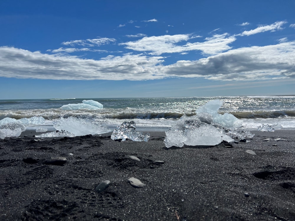 a beach that has some ice on it