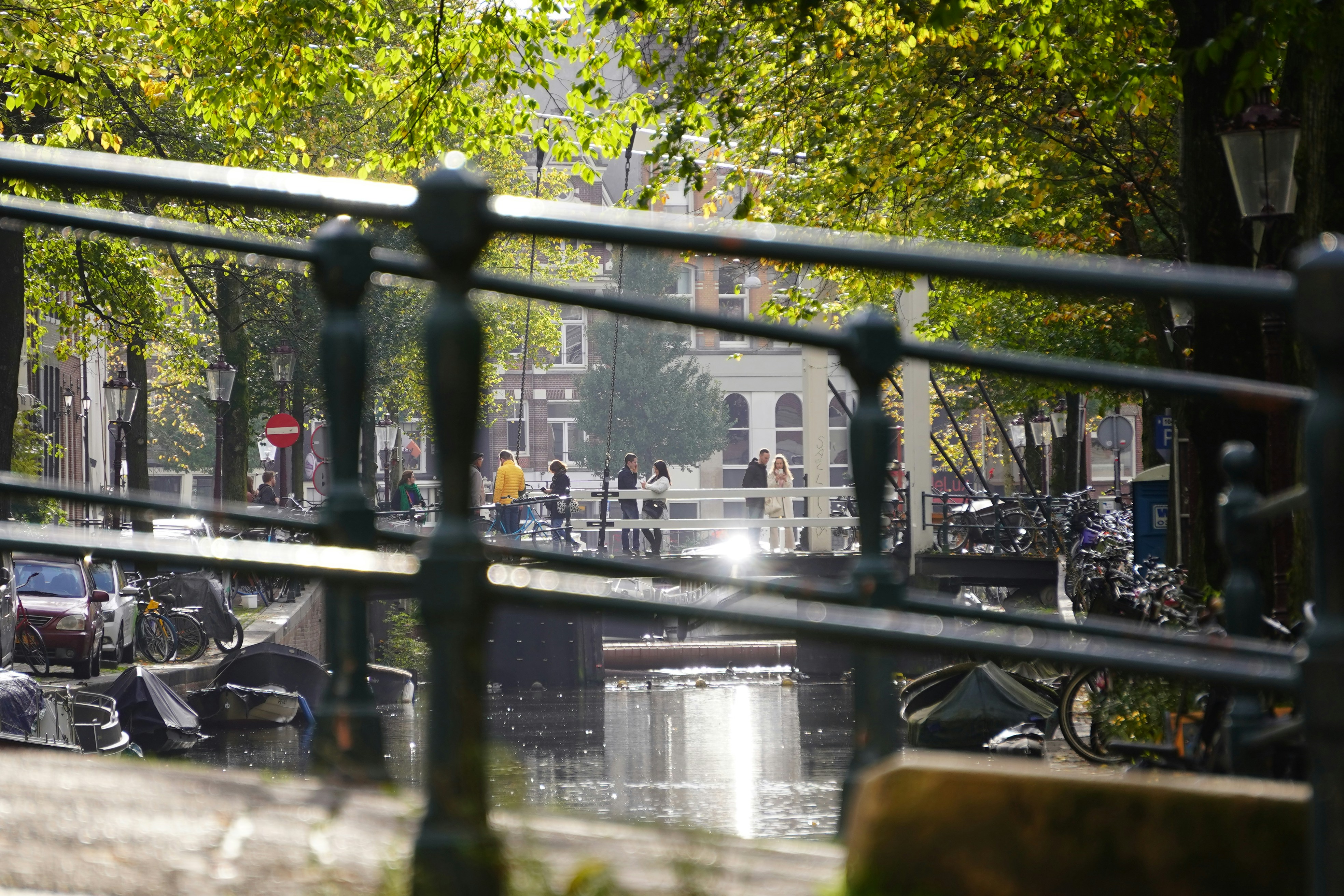 a view of a canal through a fence