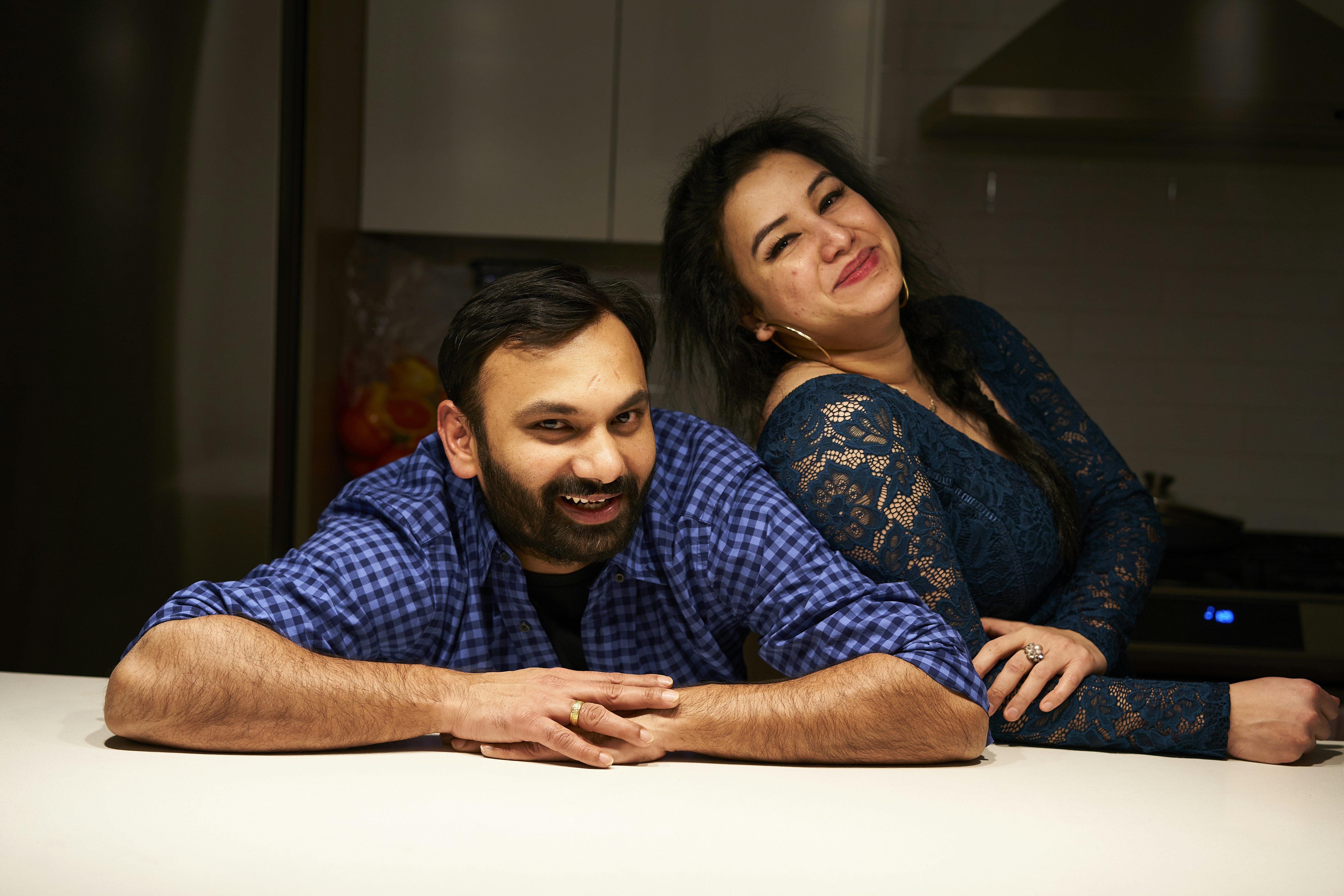 a man and a woman posing for a picture